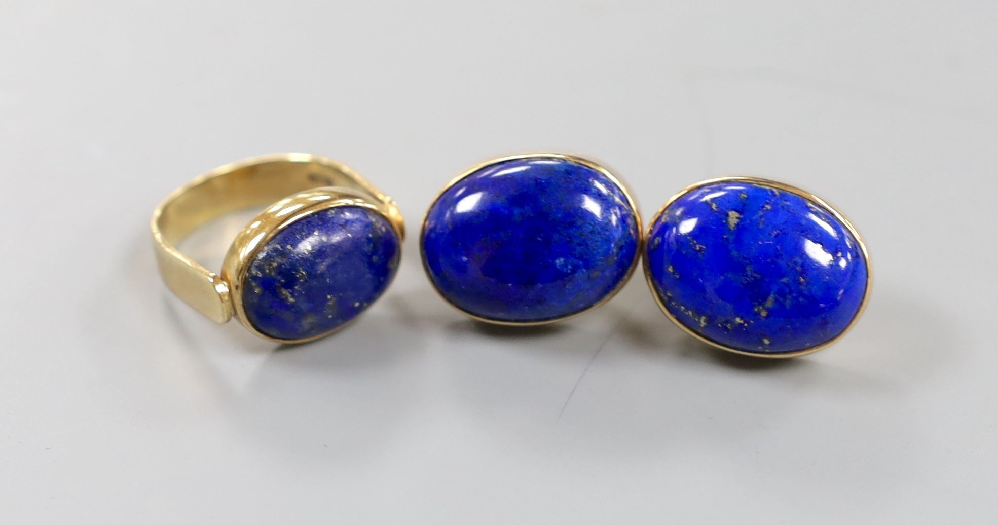 A pair of 9ct gold and lapis earrings, 21mm and a similar dress ring, size Q, gross weight, 27.2 grams.